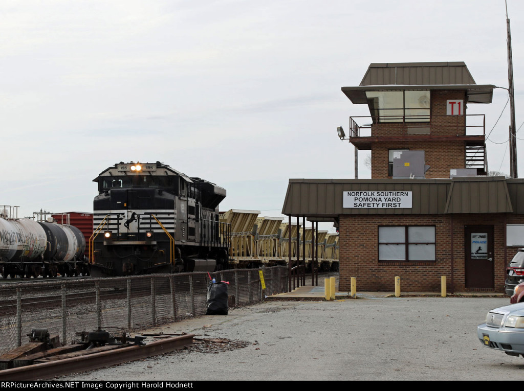 NS 1195, leading train 91X, stops at the tower